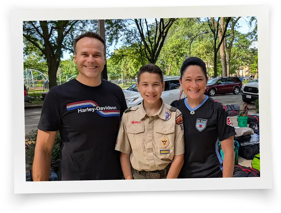 photo of Susana Mendoza with husband David Szostak and son David wearing a Boy Scout uniform